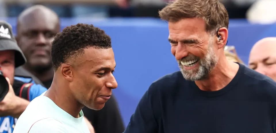 Mbappé y Klopp sonriendo durante un encuentro