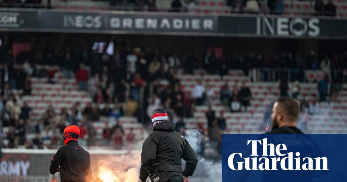Aflare being lit by fans in stadium stands Aflare being lit by fans in stadium stands