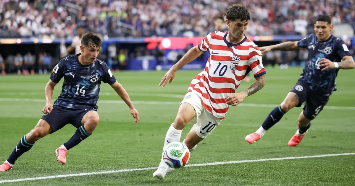 Cristian Pulisic dribbling past defenders during match Cristian Pulisic dribbling past defenders during match