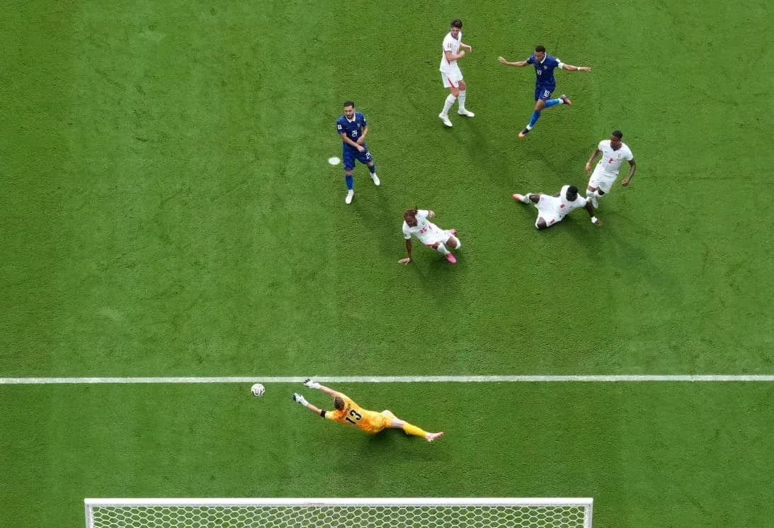 Portero deteniendo un tiro en el Mundial Portero deteniendo un tiro en el Mundial